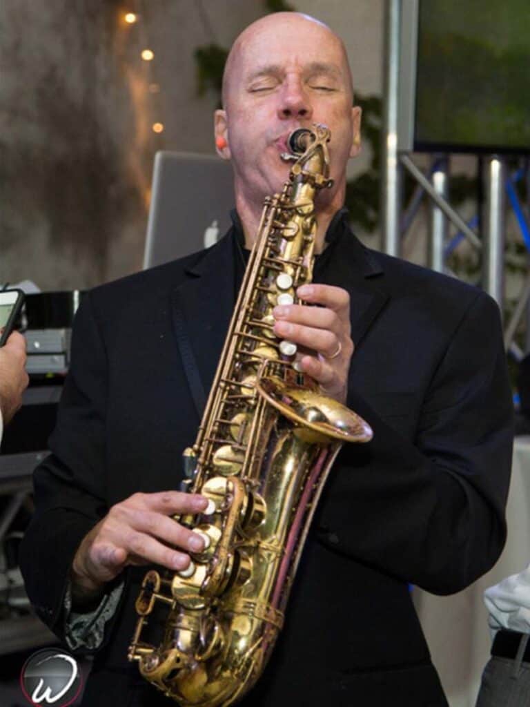 Musician Ron Lorenzo playing saxophone
