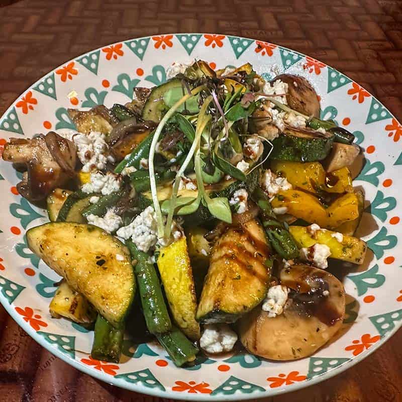 Honey and balsamic glazed seasonal vegetables topped with crumbled Gorgonzola